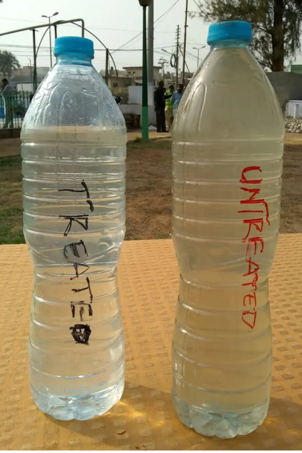 Treated versus untreated water result from a MAKES constructed wetland in Pakistan, showing clear treated water beside cloudy untreated wastewater